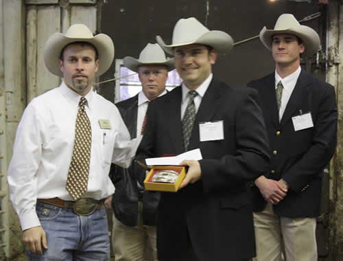 Bob McBride presents the 2009 Livestock Champion buckle to Charly Cummings Bob McBride presents the 2009 Livestock Champion buckle to Charly Cummings