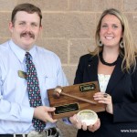 President Andy Conser presents championship plaque and buckle to Megan McCurdy