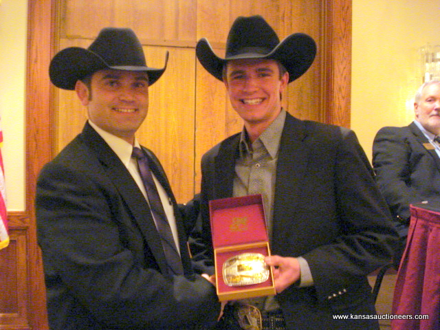 Charly Cummings presents Blaine Lotz with the buckle for the livestock contest Charly Cummings presents Blaine Lotz with the buckle for the livestock contest