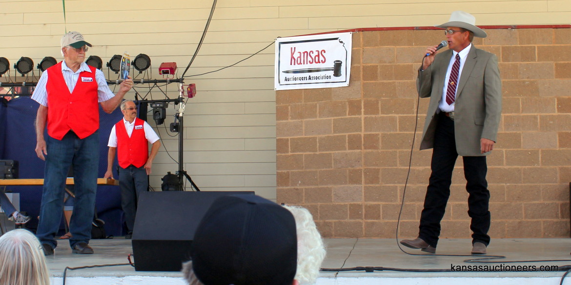 Justin Banzhaf competing in the 2015 Kansas Auctioneer finals. Justin Banzhaf competing in the 2015 Kansas Auctioneer finals.
