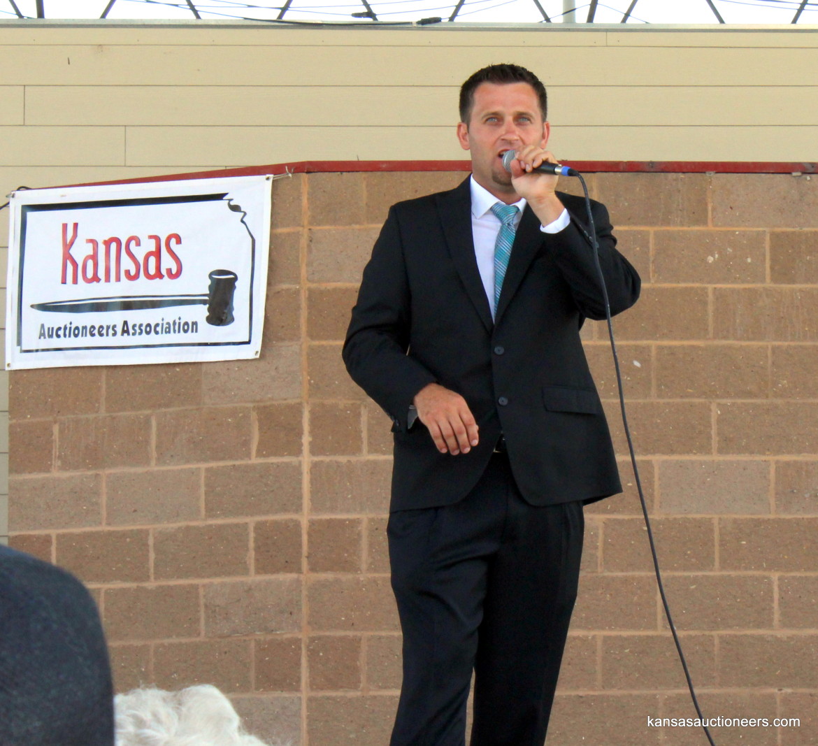 Titus Yutzy competing in the 2015 Kansas Auctioneer finals. Titus Yutzy competing in the 2015 Kansas Auctioneer finals.