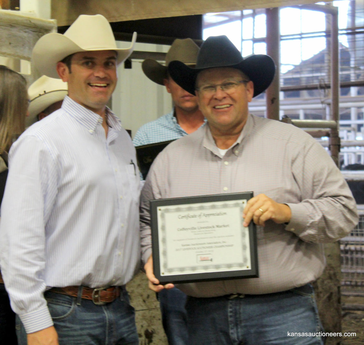 Charly Cummings with Coffeyville Livestock Market co-owner, Jimmy King Charly Cummings with Coffeyville Livestock Market co-owner, Jimmy King